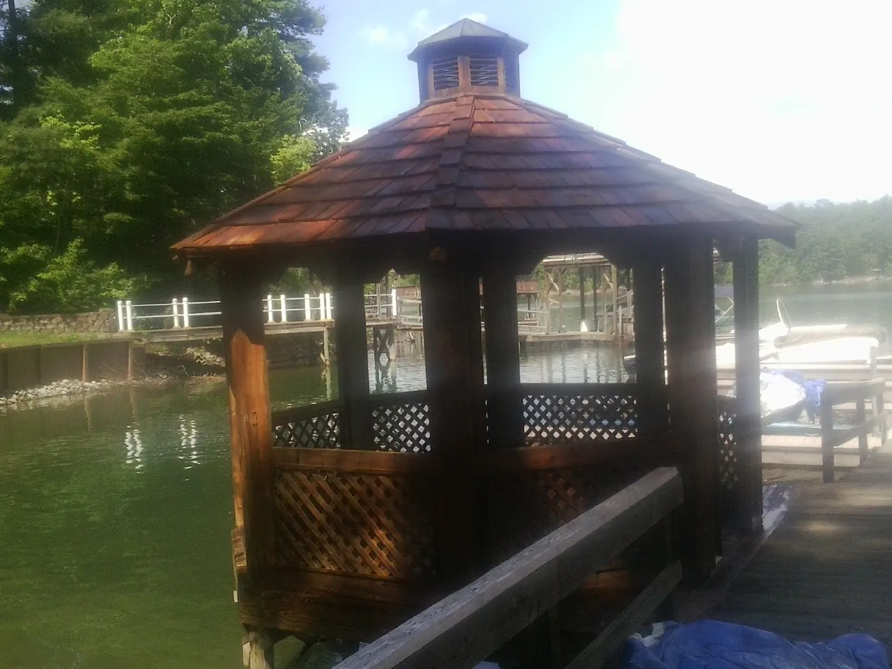 Cedar shake gazebo roof rebuilt on a lake dock in Bristow